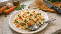 Tane tane havuçlu bezelyeli pilav: ölçüsü tam, rengiyle iştah açan tarif